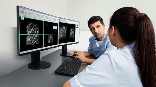 Radiographers analyzing results from Elekta Unity