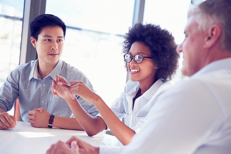 Smiling coworkers connecting with each other